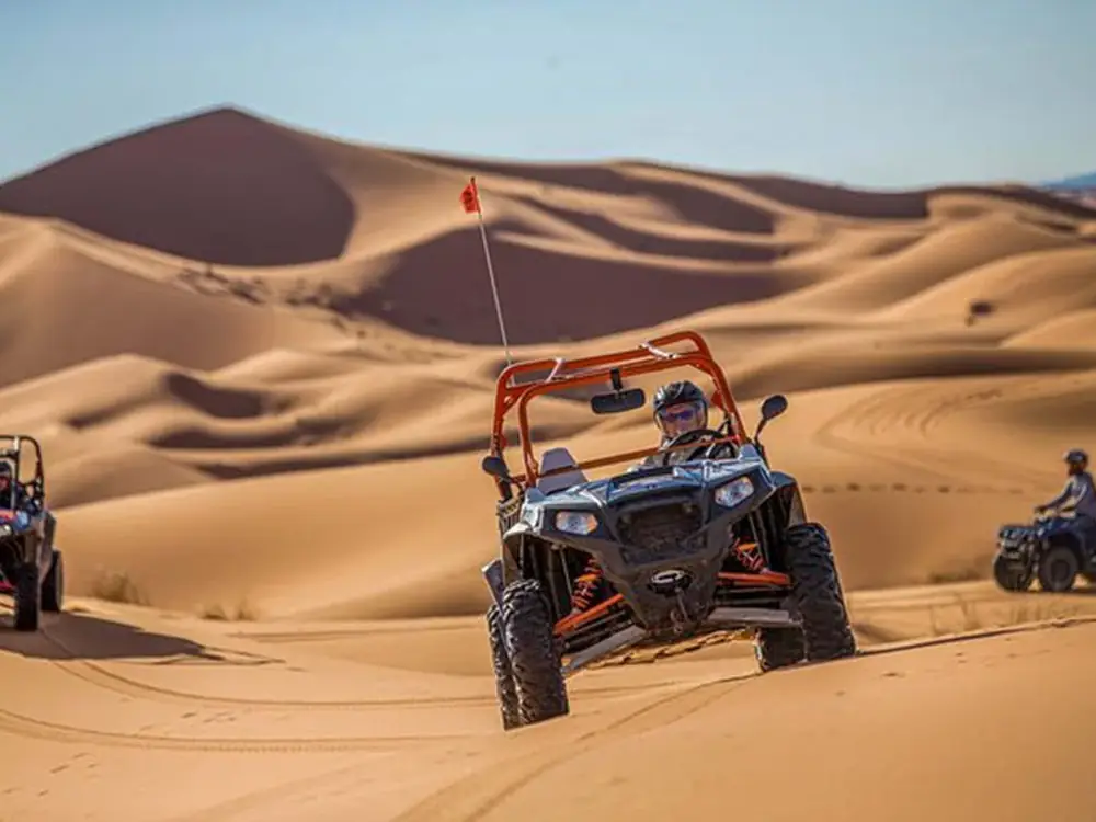 Dune buggy driving across the sand dunes