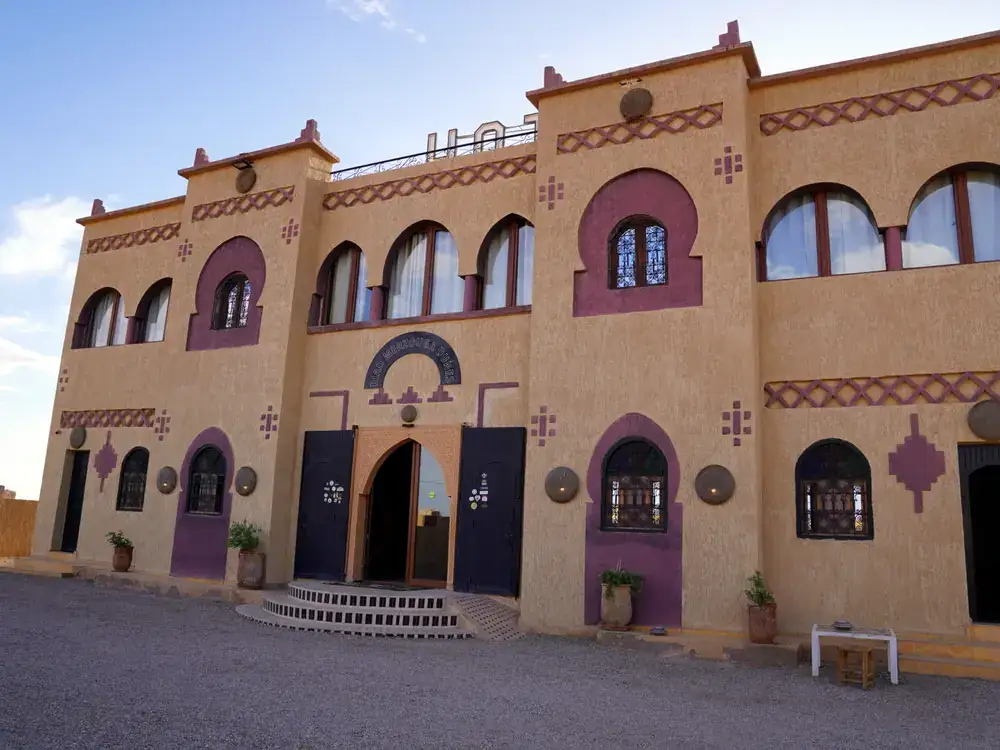 Front entrance and facade of Riad Merzouga Dunes in Ksar Tabomiat