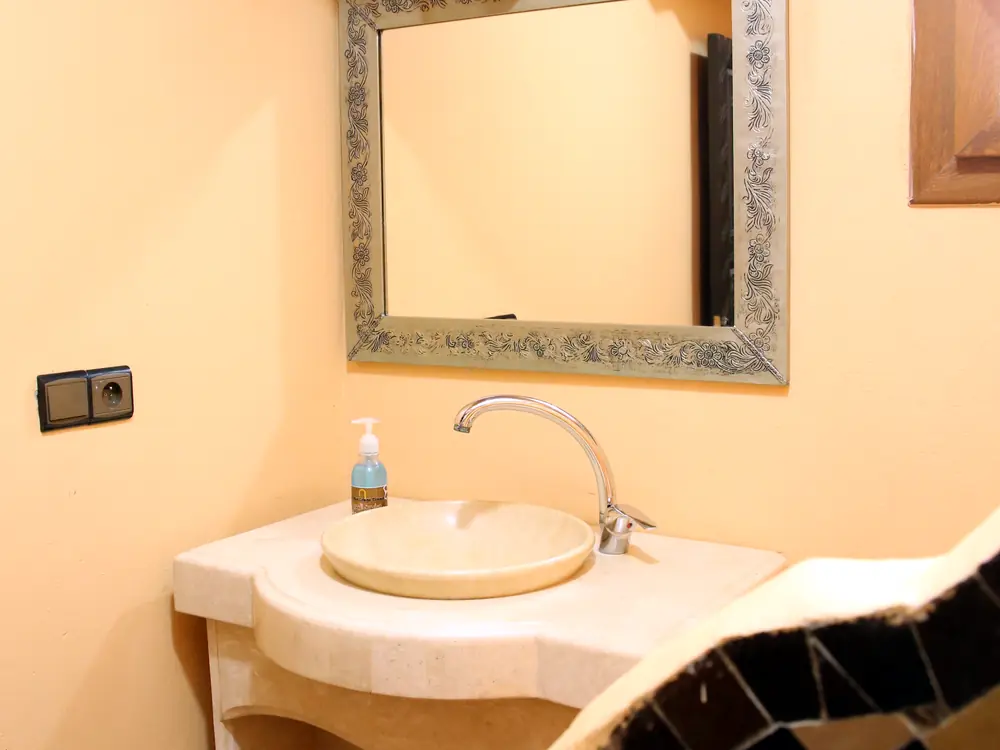 Bathroom with zellige tiles and marble sink